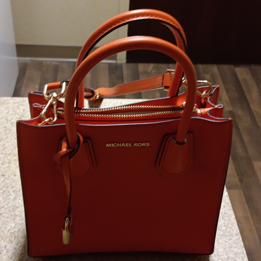 Michael Kors ladies, cross body or   regular handled handbag